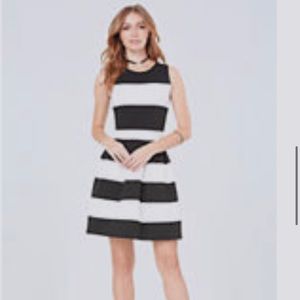Bebe. Size small. Black & white striped fit & flare dress!